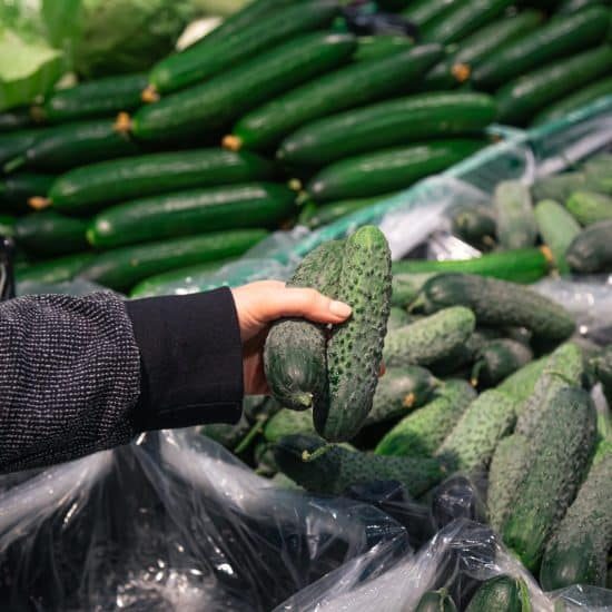 woman-chooses-cucumbers-grocery-store-scaled-rfig43fcyhbnzy6oxmf0zuu2a2vyp4b9jjln1tp2po